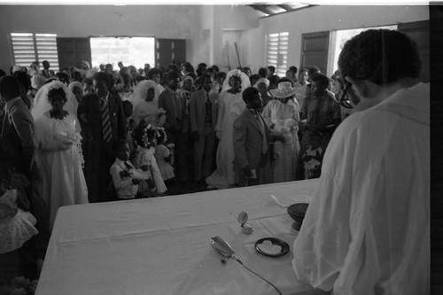 Priest celebrating multiple weddings, San Basilio de Palenque, 1975