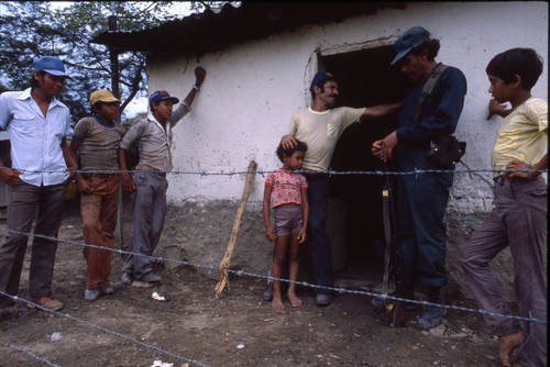 Contra soldier with people, Honduras, 1983