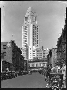 View of the nearly completed City Hall building in Los Angeles from a nearby street, 1926-1928