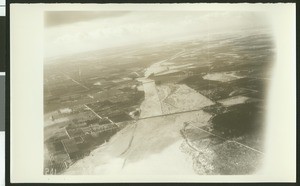 Aerial view of flooding near Colton of the Santa Ana River, showing flooding over fields, ca.1930