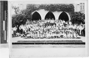 Group portrait of Maryknoll Fathers, Brothers and Sisters with Maryknoll School student body, Punahou, Honolulu, Hawaii, ca. 1930