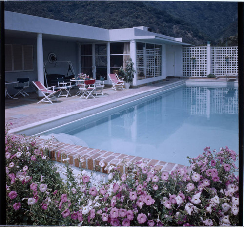 [Unidentified residential exteriors and landscaping]. Swimming pool
