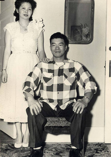 Posed photo of a Chinese American man and woman