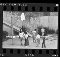 Group of boys playing basketball at Los Angeles County Juvenile Hall, 1984