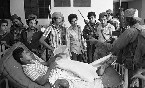 Injured Sandinista in a bed, Nicaragua, 1979
