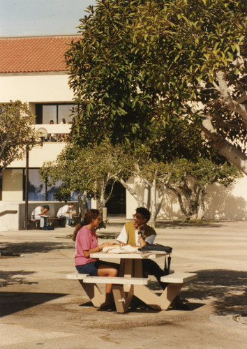 Two students in Joslyn Plaza