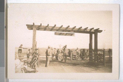 Spring, 1936, Kern County. Arvin Migratory Labor Camp - Campers volunteer labor in improving entrance to camp