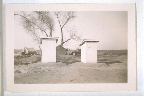 Spring, 1936, Kern County. Showing Public Health toilets put up as a result of orders to improve sanitary conditions at the Frick squatter camp