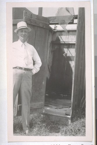 July, 1936, Kern County, Kern Lake District. Banducci Ranch. Shower. Note the broken, littered-up floor, absence of any dressing quarters, and only cold water for the shower. The drain resulted in a mud hole forming in front of the door. The only shower available for the laborers and their families from several cabins