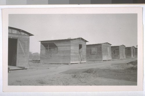 July, 1936, Kern County, Kern Lake District. Row of cabins for farm laborers