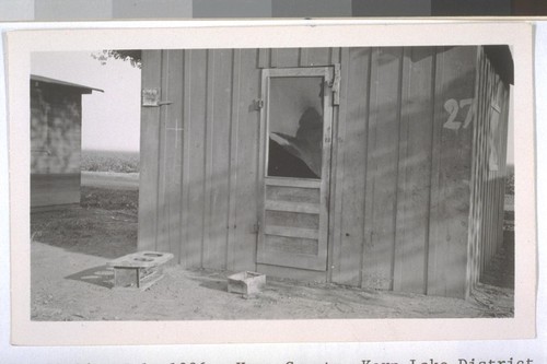 July, 1936, Kern County, Kern Lake District. Banducci Ranch. A typical cabin for laborer and his family. Note the broken screen door