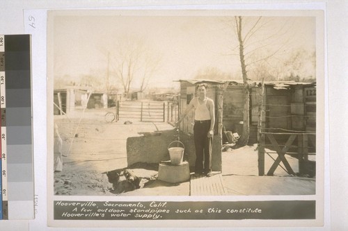 Hooverville, Sacramento, California. A few outdoor standpipes such as this constitute Hooverville's water supply