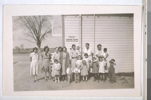 Spring, 1936, Kern County. Arvin Migratory Labor Camp - mothers and children at health clinic