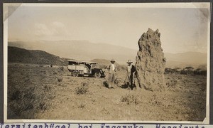 Missionaries near termite hill, Tanzania, ca.1930-1939