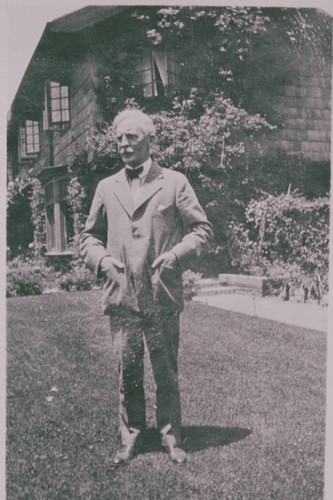 R. C. Gillis in front of his home at 406 Adelaide Drive in Santa Monica, Calif