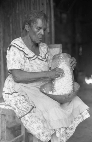 Woman grating coconut, San Basilio de Palenque, 1976