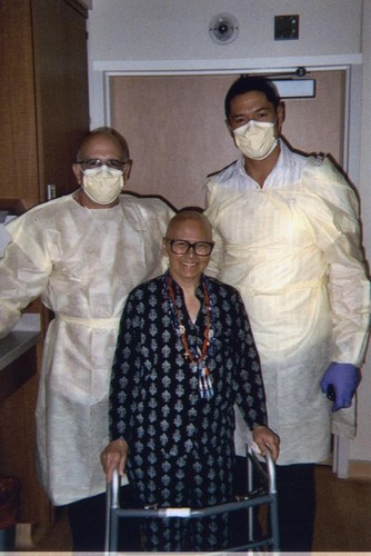 Patricia Whiting posing with visitors in the hospital