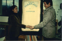 Vince and Patricia Whiting holding a marriage license