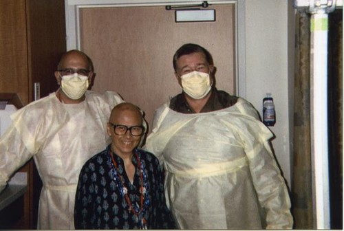 Patricia Whiting posing with visitors in the hospital