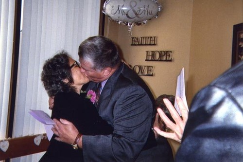 Vince and Patricia Whiting embracing in a kiss