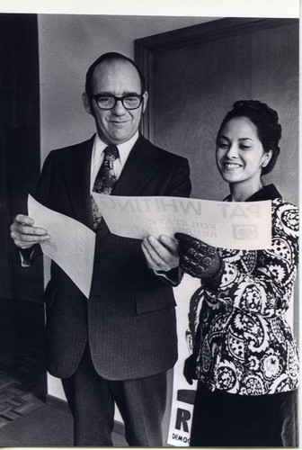 Patricia Whiting with Jim Redden looking over campaign sign