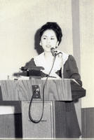 Patricia Whiting speaking at a podium