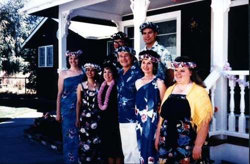 Group portrait of Vince and Patricia Whiting with family at their third wedding