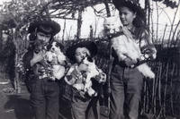 Patricia and sisters holding animals