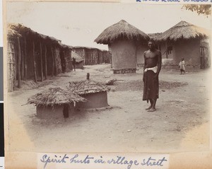Spirit huts in a village street