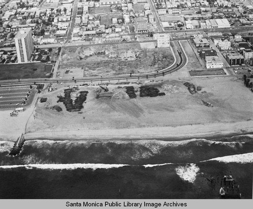 Looking east from the remains of the Pacific Ocean Park Pier toward Ocean Park and the Santa Monica Shores Apartments high-rise, June 3, 1975, 2:30 PM