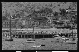 View of the shore of Avalon bay with buildings in the background, ca.1900