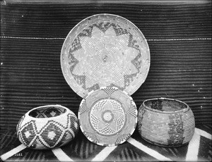 Four Indian baskets on display, ca.1900