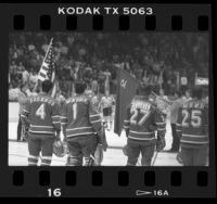 Hockey players watching presentation of flags at Los Angeles Kings vs Russia's Red Army game, Calif., 1985