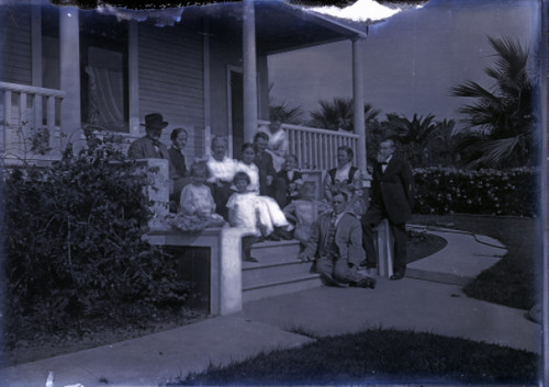 Family on Porch of House