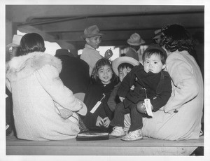 "A far cry from Tanforan as Bay Area horse racing fans knew it in pre-war times is this scene at the peninsula track today as vanguard of SF Japs, including children arrived there."--caption on photograph