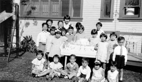 Peter Soo Hoo Jr. at a birthday party at Barbara Jean Wong's house with Barney, Aunt Eleanor, Layne Tom and others