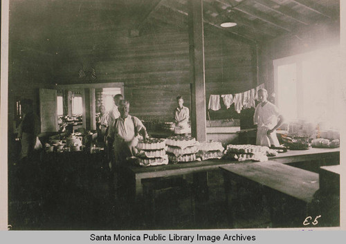 Staffers stand inside the kitchen and dining hall of the Chautauqua camp in Temescal Canyon