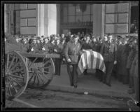 Pallbearers carry William Traeger's coffin out of Patriotic Hall after funeral services, Los Angeles, 1935