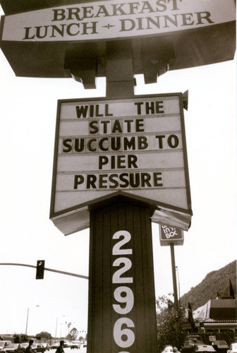 Malibu Inn marquee message "Will the state succumb to pier pressure", 1990s