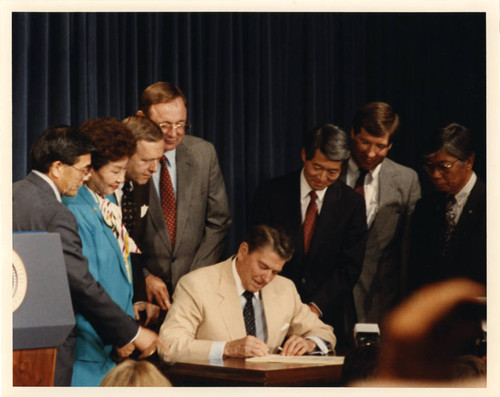 [Photograph of President Ronald Reagan signing the Civil Liberties Act of 1988 on August 10, 1988]