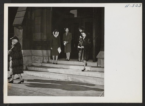 Church is a Sunday must with many of the young Nisei girls. Here are four girls who have just attended a sermon by Rev. William Clyde Howard, pastor of the Second Presbyterian Church on Michigan Boulevard. Photographer: Mace, Charles E. Chicago, Illinois