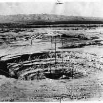 Caption reads: "This picture of a subsidence test plot installtaion on the California Aqueduct alignment shows where seven feet of sinking has occured."