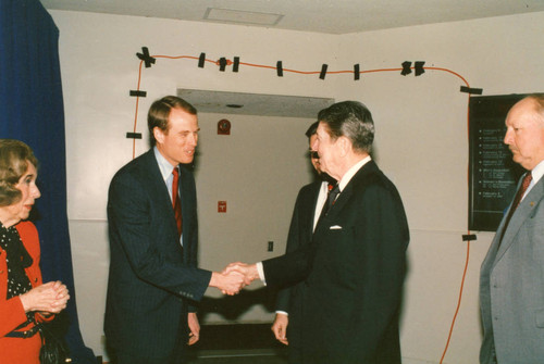 President Reagan shaking hands with Regent Chair Tom Bost