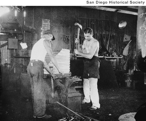 Lee Ramage and his assistant working in at blacksmith's forge