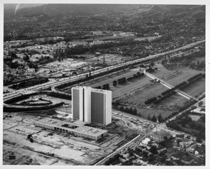 Aerial view facing north over the Veteran's Administration in West Los Angeles at Wilshire Boulevard and the San Diego Freeway (I-405)