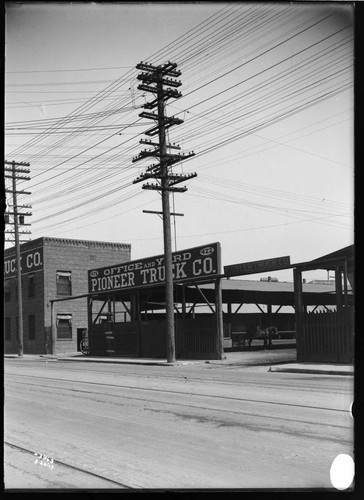 Distribution Lines - Joint Pole Construction at 422 North Alameda Street. [Shows Pioneer Truck Co