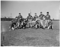 Members of the Loyola University football team with their coach, Los Angeles, 1930s