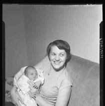 A woman holding an infant