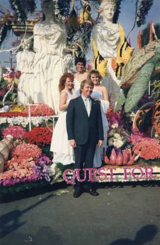 Michael Adams and student representatives posing with the float