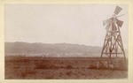 [View of field with windmill]